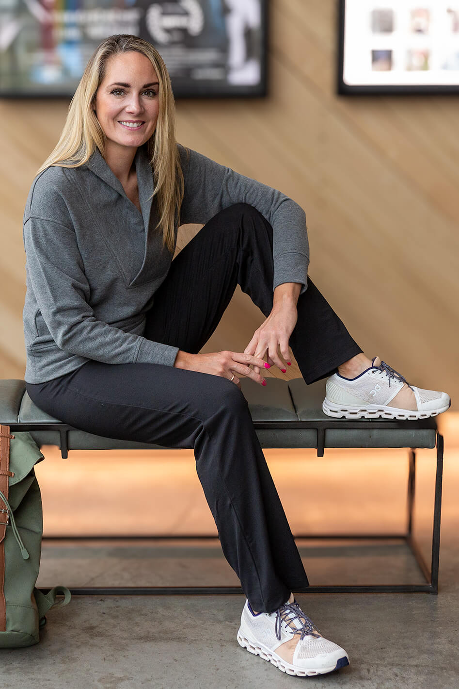 Woman on bench wearing yoga pants