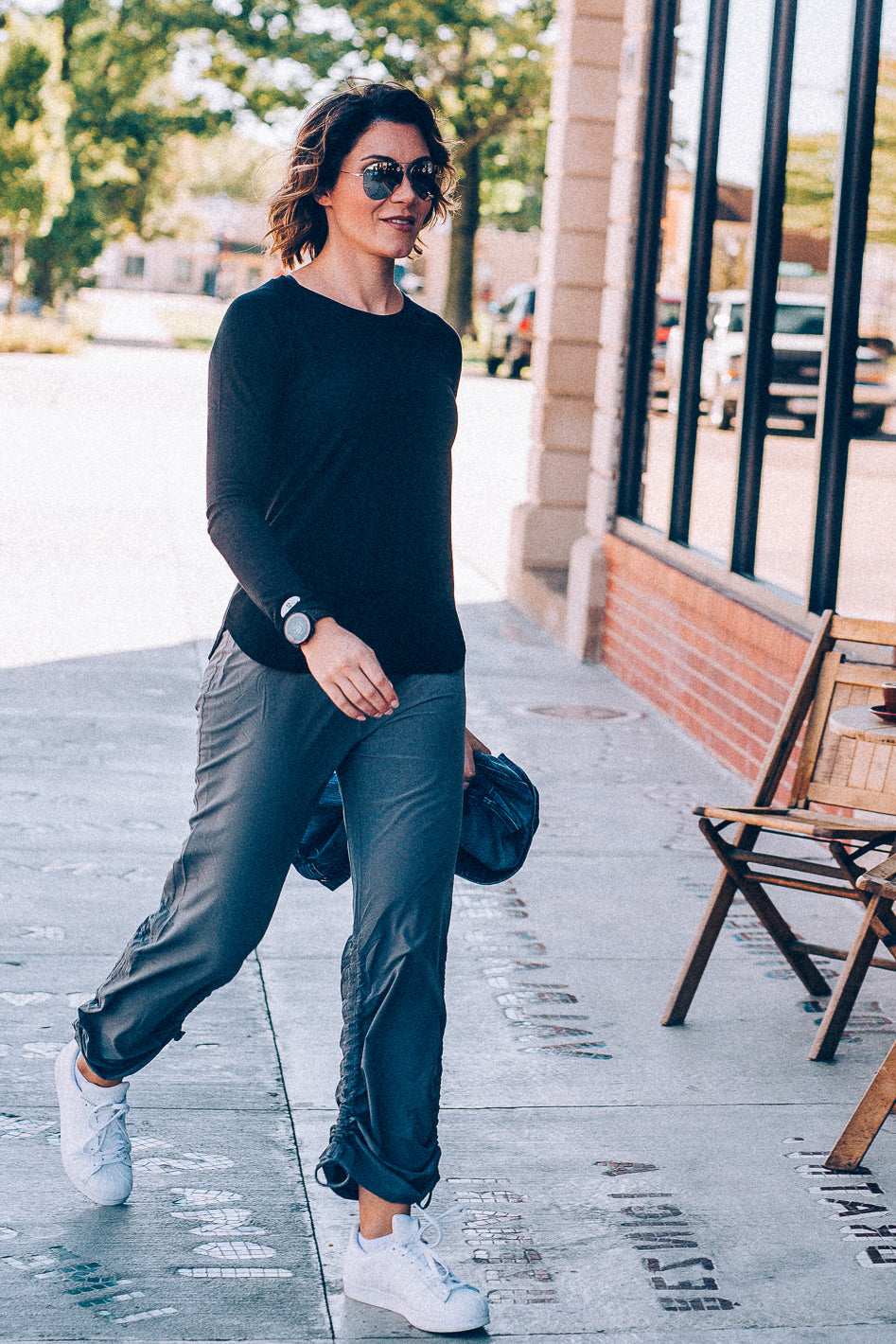 Woman wearing grey Motion Bootcut Pants showing flattering fit for different body types - Find Your Perfect Fit guide