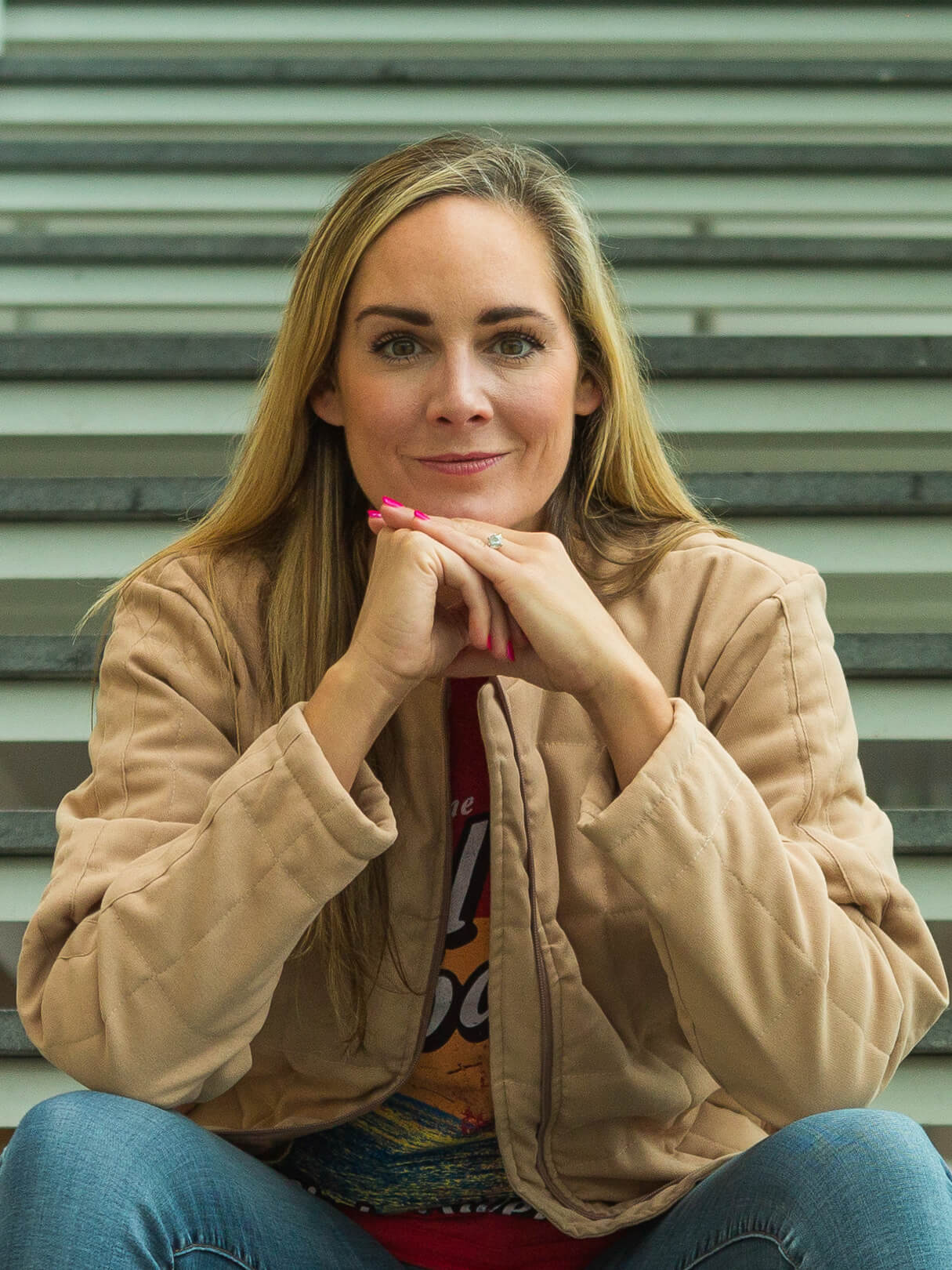 Cool, confident woman sitting on stairs